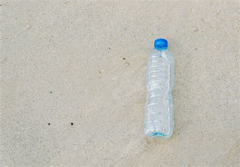 Premium Photo Plastic Bottle Garbage On The Beach Human Waste Dumping