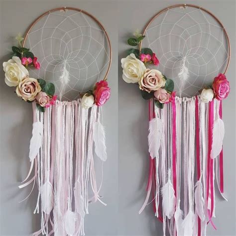 Two Pink And White Dream Catchers Hanging On The Wall Next To Each
