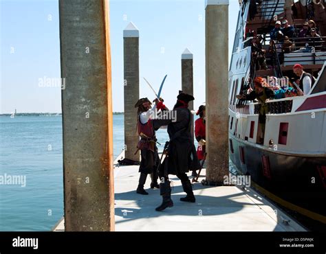 A Pirate Ship The Black Raven And Sword Fighting Pirates Near The