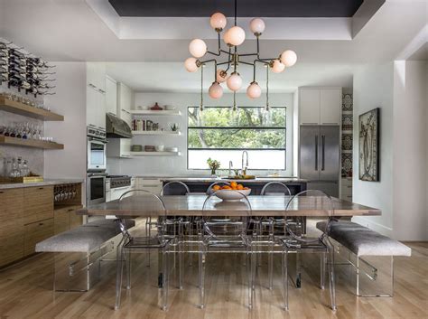 In our villa bonita kitchen, brass lighting contrasts with chrome hardware and faucets but is balanced by the barstools. Mid Century dining/kitchen with mixed metals and frosted ...