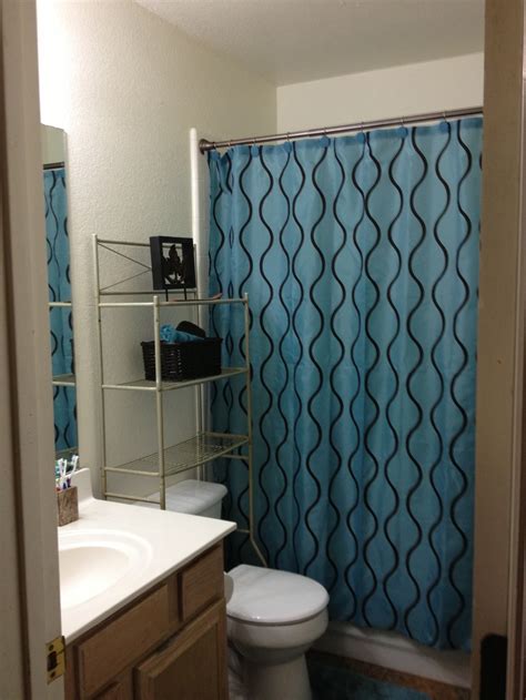 Layer light and dark shades of a single hue in your bathroom backsplash with a neutral accent color such as white. Teal & Brown | Small Bathroom Ideas | Pinterest