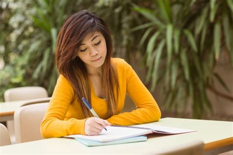 Premium Photo Female College Student Doing Homework