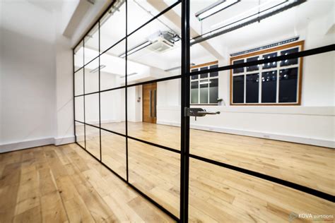 Industrial Style Black Framed Partition Installation Of Glass