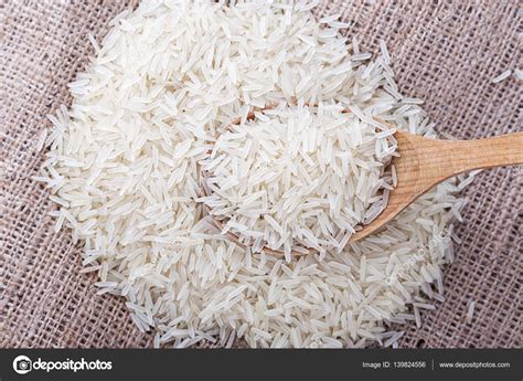 Uncooked rice is scattered — Stock Photo © Alexshyripa #139824556