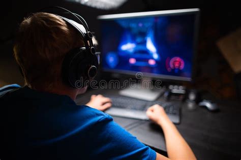 Caucasian Young Teen Guy Plays Games On Computer And Streams The Games