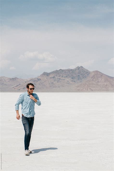 Lifestyle Portrait Of Young Man In Desert Salt Flats Usa Utah Del