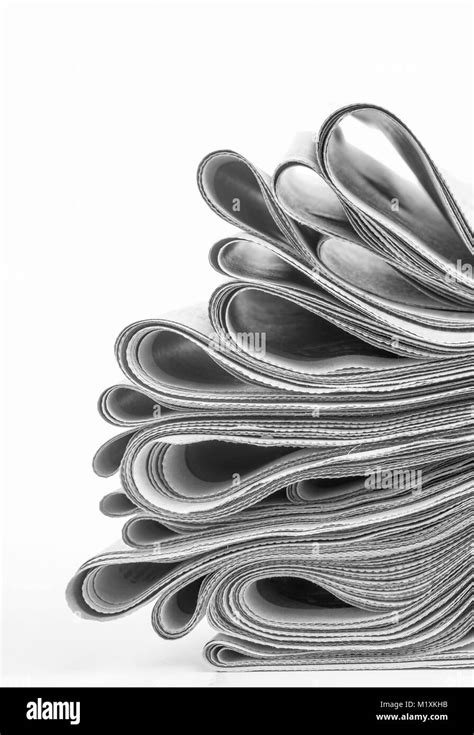 Newspapers Folded And Stacked On White Background Stock Photo Alamy