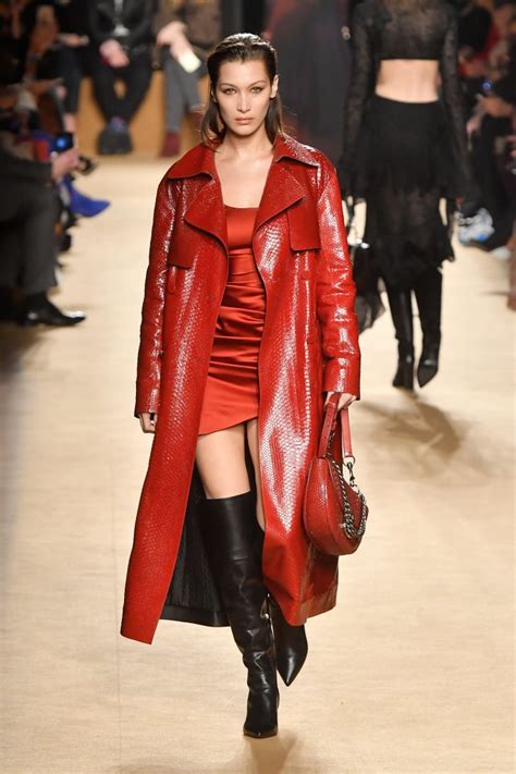 At Roberto Cavalli Wearing A Red Trench Coat And Minidress Bella Hadid At Fashion Week Fall