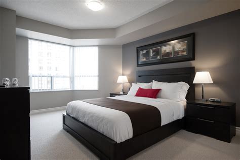 A grey bed is a strong, mature option for your bedroom. DelSuites - quality furnished apartments - Tridel