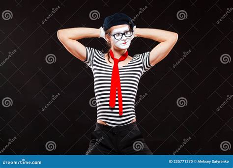 Portrait Of Male Mime Artist Performing Isolated On Black Background