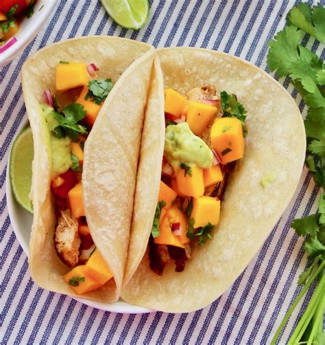 This transforms this cilantro lime chicken in to a tasty and healthy meal that is sure to be a hiton. Chicken Tacos with Mango Salsa - #foodbyjonister