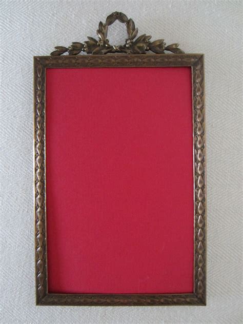 Art Deco Brass Picture Frame Decorated Floral Crest Loop For Sale