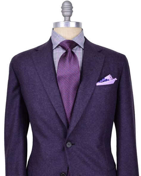 Man in purple suit holding roses. Brioni purple wedding suit | Purple suits