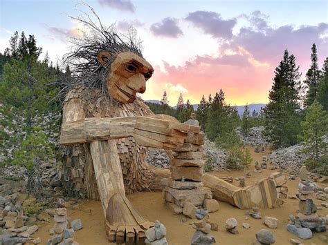 Giant Wooden Troll Sculptures Greet Visitors In The Forest American