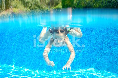 Happy Active Underwater Girl Swims In Pool Stock Photo Royalty Free