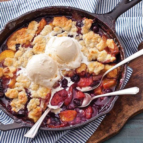 Fresh Peaches And Blueberries Melt Together Beneath A Layer Of Buttery