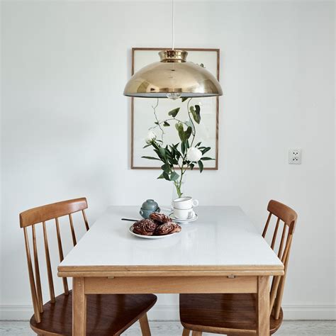 The dining tables surround two sides of this open kitchen, making it the center of attraction. 10 Best Kitchen and Dining Tables for Small Spaces