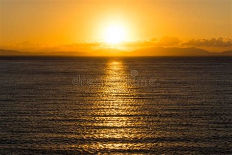 Sunrise Over The Sea And Mountains On The Horizon Stock Image Image
