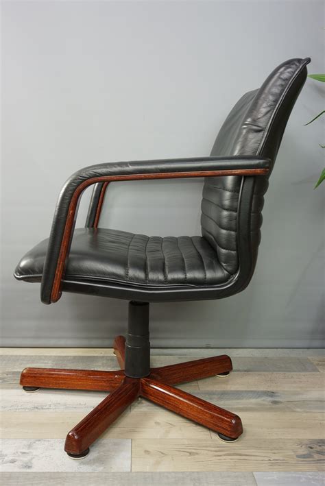 Dreamstime is the world`s largest stock photography community. Vintage swivel office chair in wood and leather - 1960s ...
