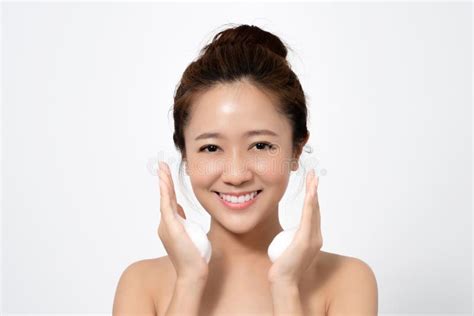 Beautiful Asian Woman Is Using A Facial Foam To Wash Cosmetics Off Her