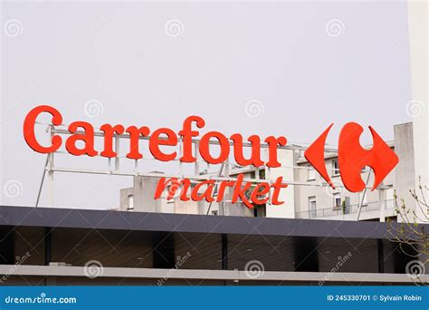 Carrefour Market Store Brand Sign And Text Logo On Roof Facade