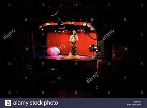 A Drag Queen Sings While Performing During A Burlesque Show Inside A