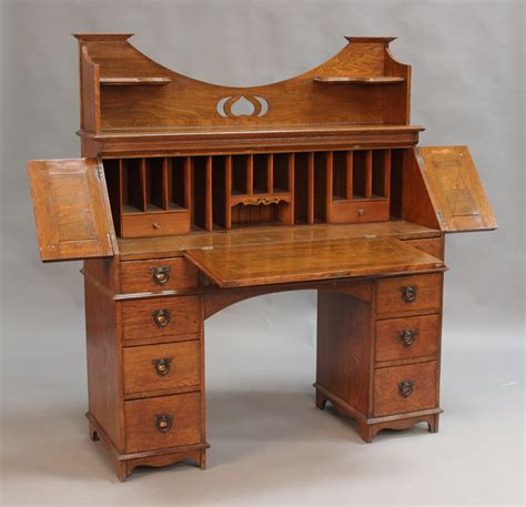 An Early 20th Century Arts And Crafts Oak Desk Labelled The Britisher