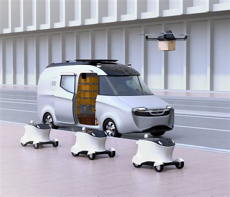 Fleet Of Self Driving Delivery Robots Van And Drone At The Side Of