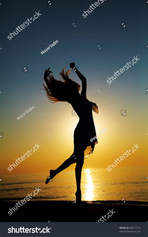 Girl Dances On Beach Sunset Natural Stock Photo Shutterstock