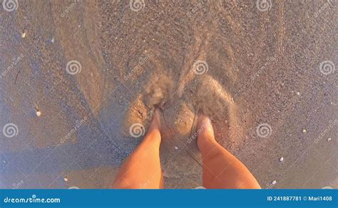 Girl Bare And Naked Feet Digging Into Wet Sand Of Beach On Seashore At Sunset Stock Video