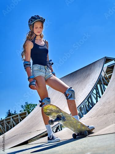 Teen Girl Rides His Skateboard In Skatepark Outdoor Skateboarding Is