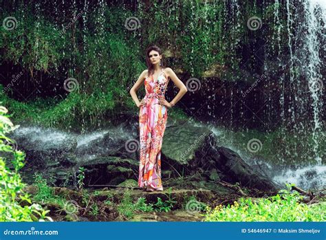 Young Woman In A Long Dress Near A Waterfall Stock Image Image Of
