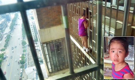 chinese girl 5 rescued after she got her head stuck in bars on outside of apartment block s