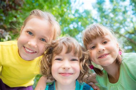 Group Of Happy Children Playing Outdoors Stock Photo Image Of Girl