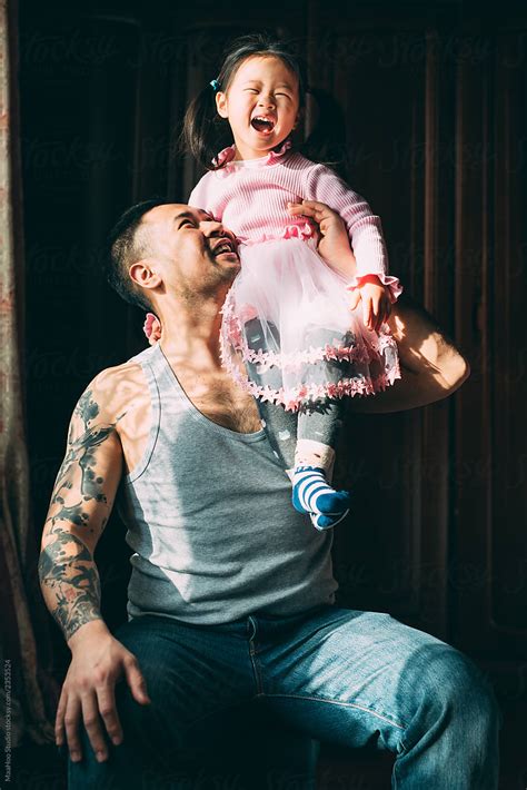 Father With Daughter At Home By Stocksy Contributor Maahoo Stocksy