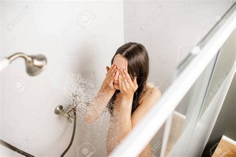 Young And Beautiful Woman Washing Her Face Taking A Shower In The White Cabin View From Above
