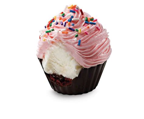 A Chocolate Cupcake With Pink Frosting And Sprinkles On White Background