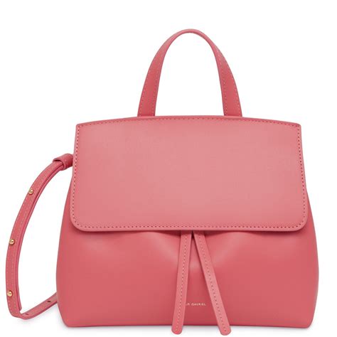 The bag features a flat leather top handle, and a optional shoulder strap with gold hardware. Mansur Gavriel Leather Calf Mini Mini Lady Bag - Dolly in ...