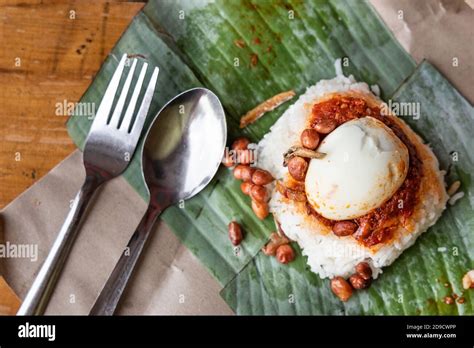 Simple Authentic Nasi Lemak Wrapped In Banana Leaf For Breakfast Stock