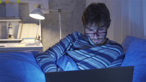 Person Falling Asleep While Looking At Laptop In Bed Person Working On Laptop In Bed Falls