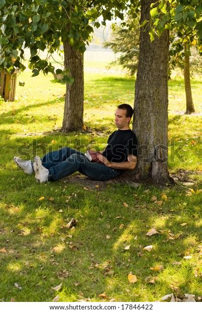 Man Sitting Under Tree Reading Park Stock Photo 17846422 Shutterstock