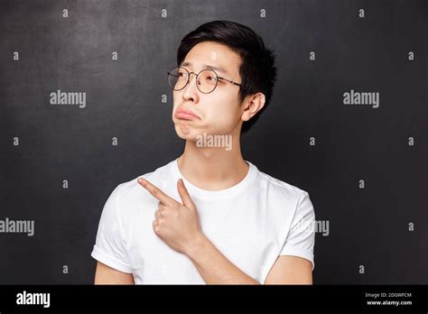 Close Up Portrait Of Jealous And Gloomy Asian Young Man Feel Regret