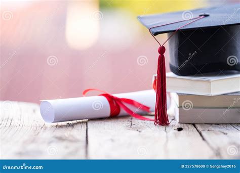 Close Up Selective Focus Of A Graduation Cap Or Mortarboard And Diploma