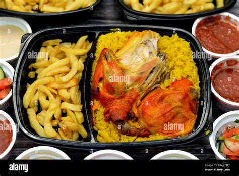 Chicken Mandi Kabsa With Long Basmati Rice And French Fries Served