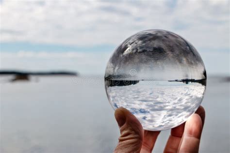 Hand Holding Acrylic Crystal Ball By A Lake Stock Photo Image Of