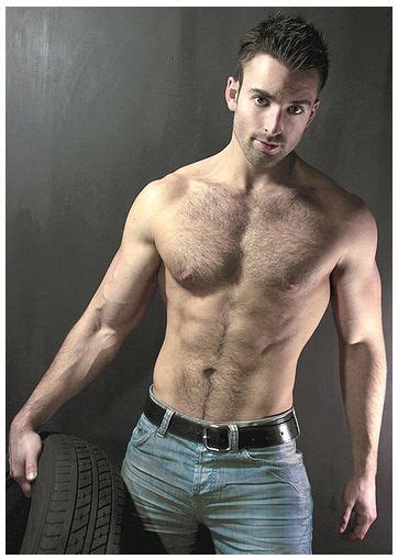 Buffed Shirtless Hunk With Sexy Chest Hair Wearing Jeans And Holding A Tire All Tired Out