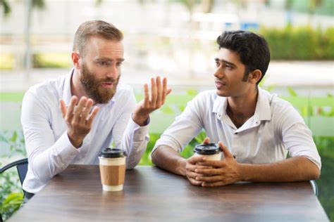 104300 Two Men Talking Outside Stock Photos Pictures And Royalty Free