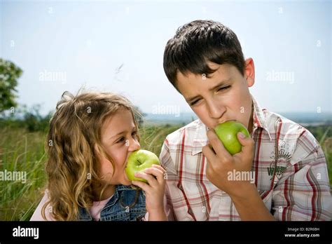 Children Eating Apples Stock Photo Alamy