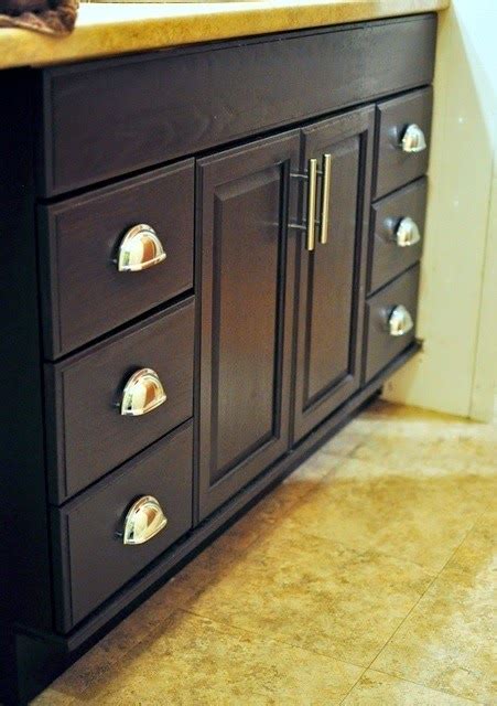 Apply stain or paint stripper to the previous stained or painted surfaces of the cabinets and doors. Staining Oak Cabinets an Espresso Color {DIY Tutorial} | Monica Wants It