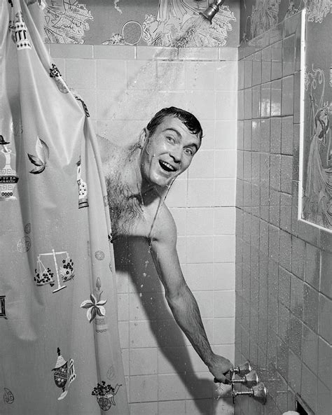 1950s Man In Shower Turning On Water Photograph By Vintage Images